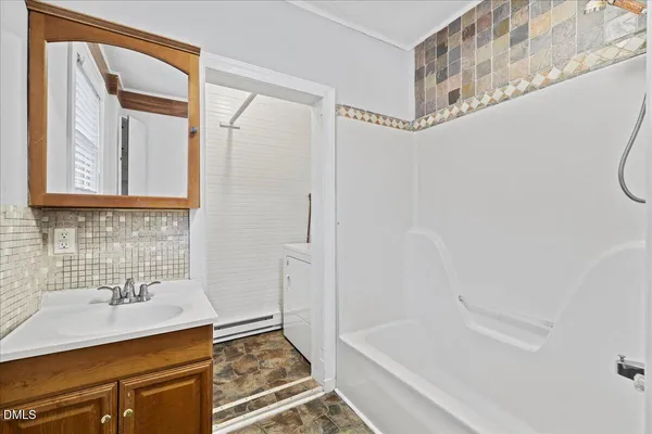 a bathroom with a sink and a bathtub