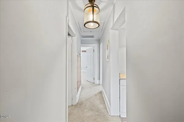 a bathroom with a granite countertop mirror and a shower