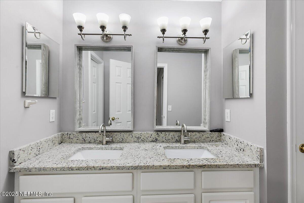 1315 Fruit Cove Road South Jacksonville, FL 32259 - Photo 11 of 19 a bathroom with a granite countertop sink and a mirror