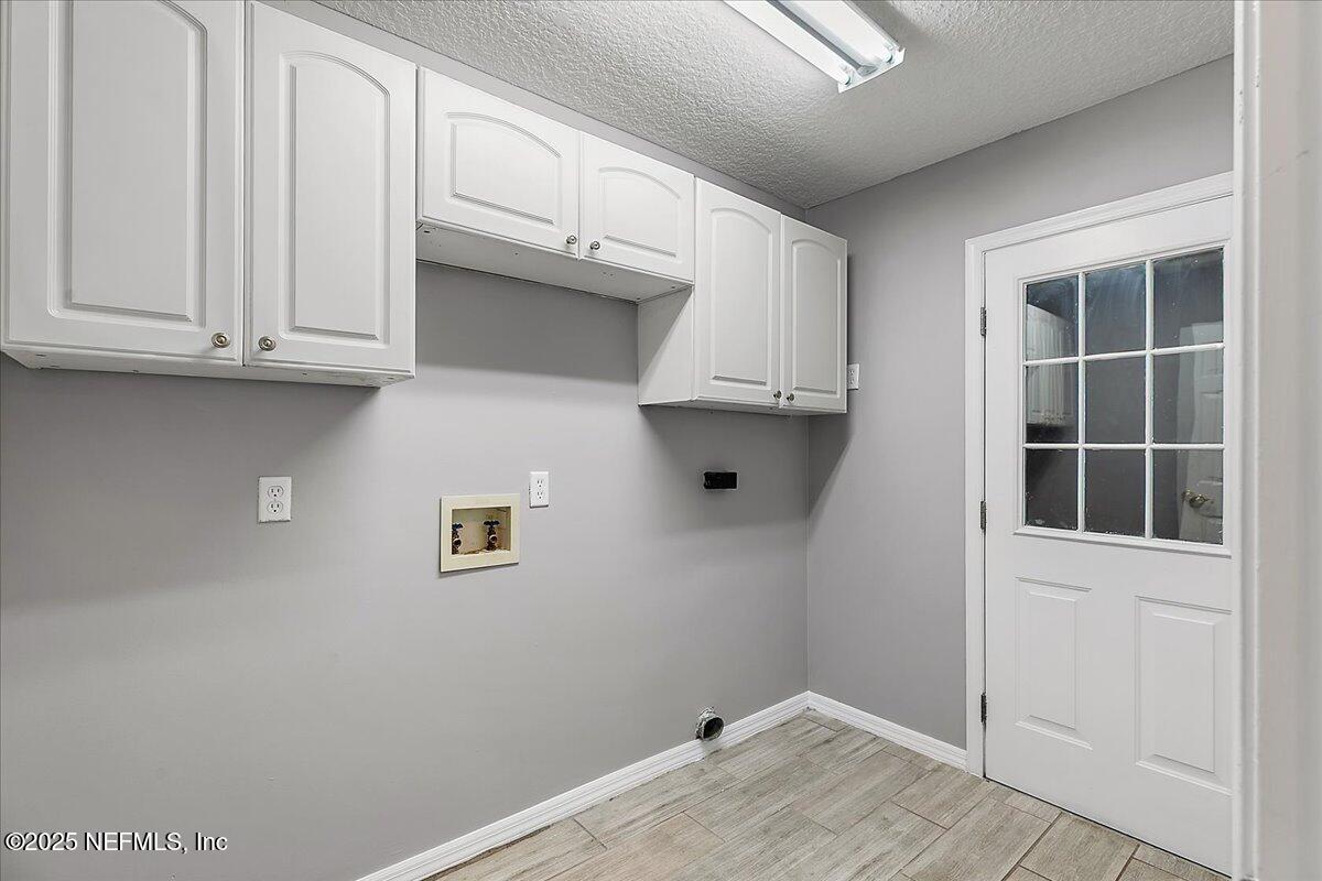 1315 Fruit Cove Road South Jacksonville, FL 32259 - Photo 16 of 19 a view of kitchen with white cabinets and a window