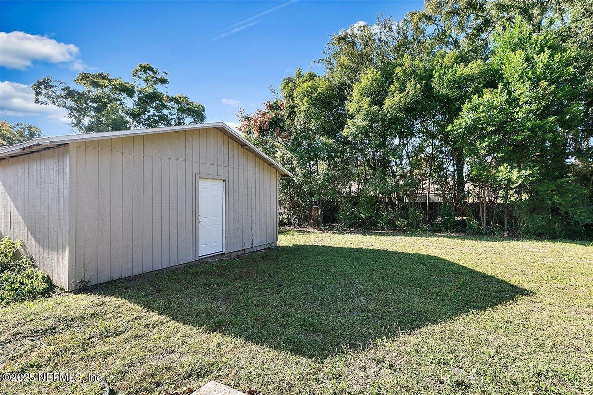 1315 Fruit Cove Road South Jacksonville, FL 32259 - Photo 18 of 19 a backyard of a house with lots of green space