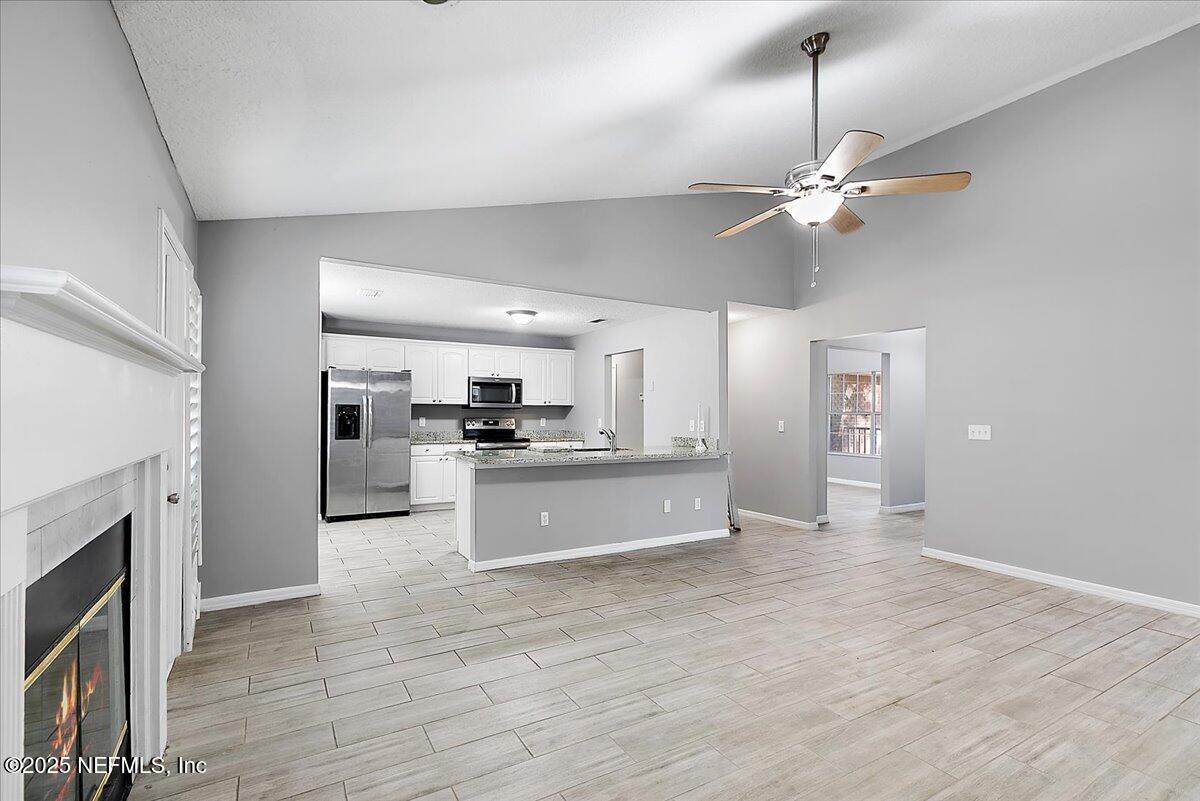 1315 Fruit Cove Road South Jacksonville, FL 32259 - Photo 7 of 19 a large kitchen with a refrigerator a stove top oven a sink and dishwasher