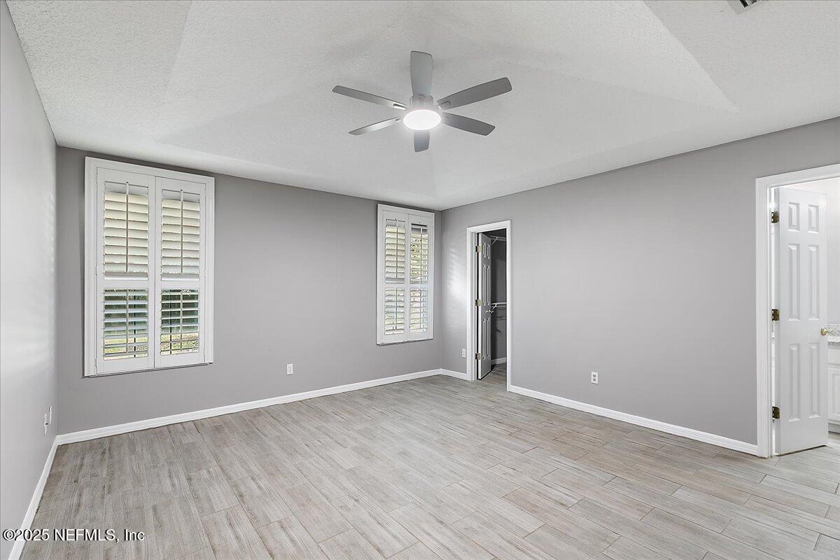 1315 Fruit Cove Road South Jacksonville, FL 32259 - Photo 10 of 19 wooden floor in an empty room with a window