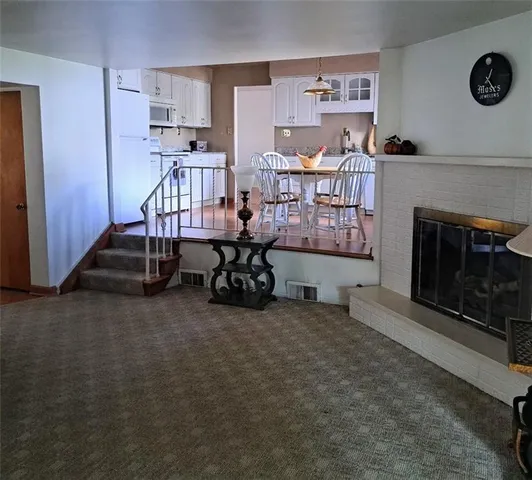 a room with furniture and a fireplace