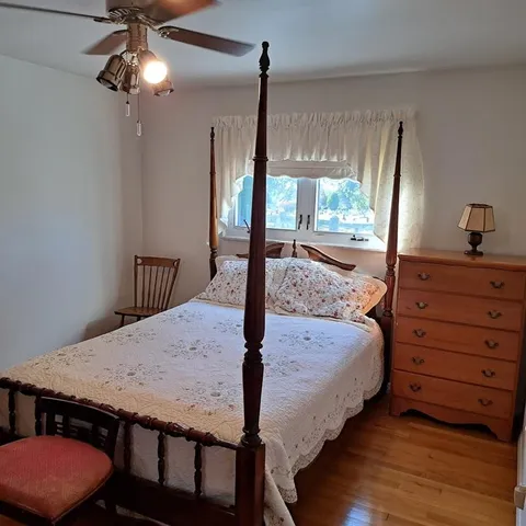 a bed room with a bed and a chandelier