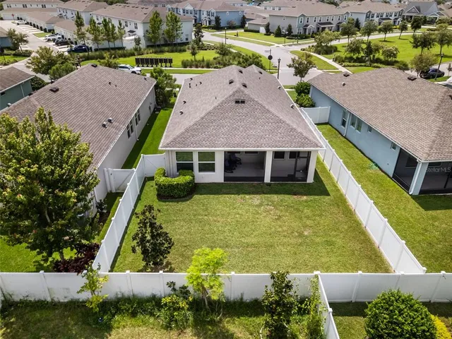 an aerial view of a house with a ocean view