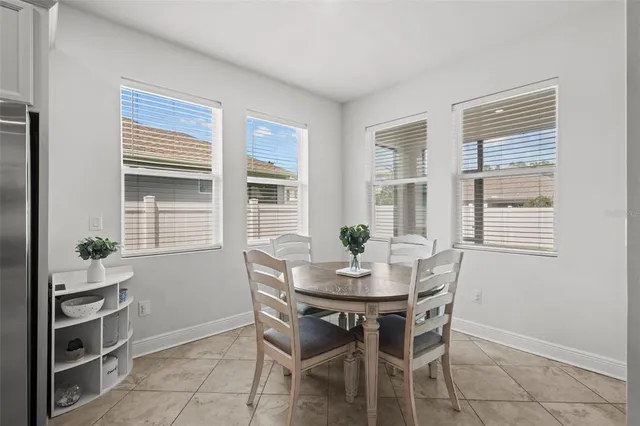 a dining room with furniture and window