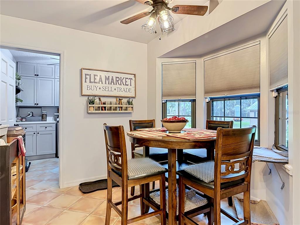 1395 Maytown Road Osteen, FL 32764 - Photo 27 of 65 a view of a dining room with furniture and window