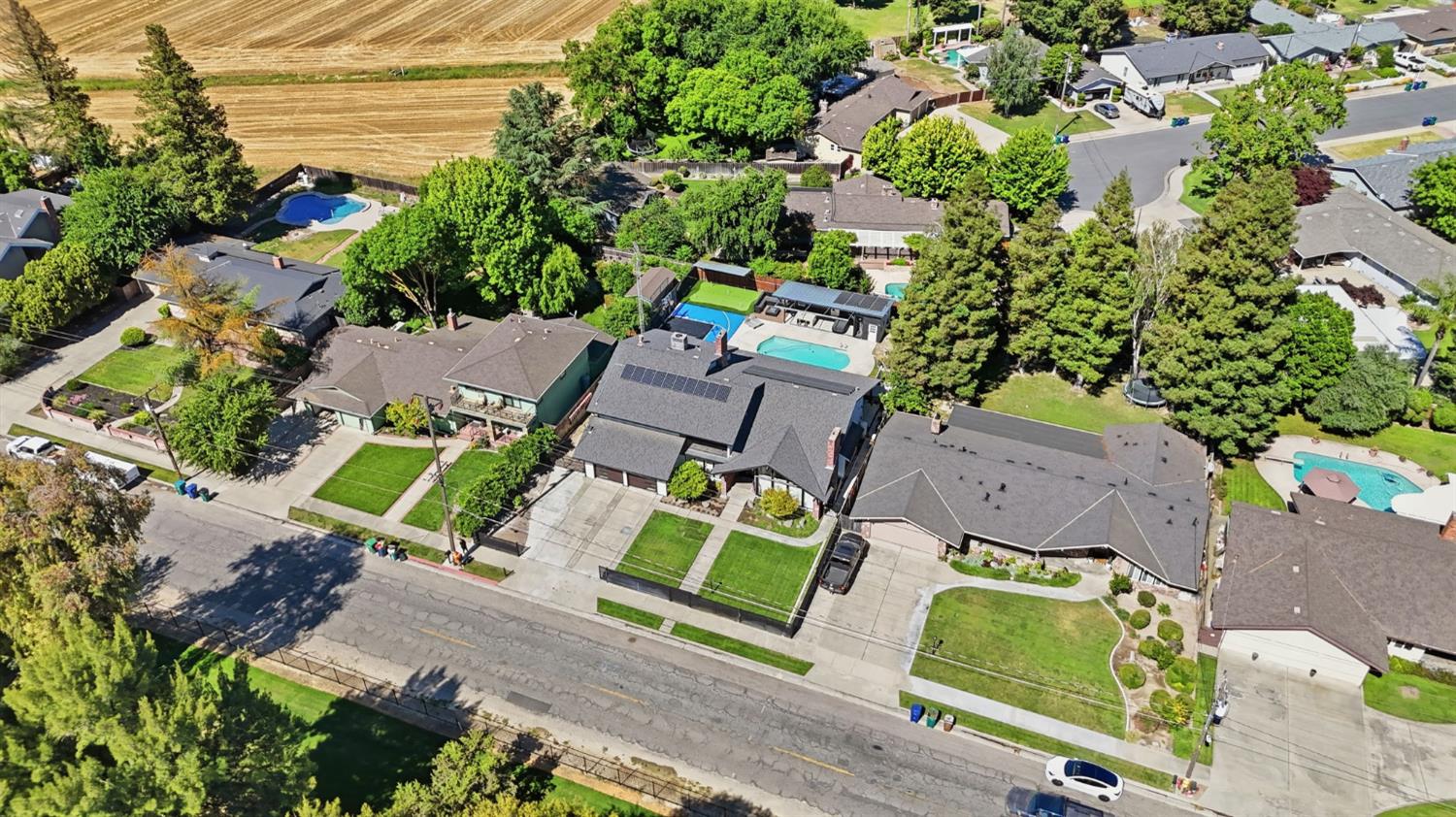 10401 Golf Link Road Turlock, CA 95380 - Photo 55 of 63 an aerial view of a house with a yard and lake view