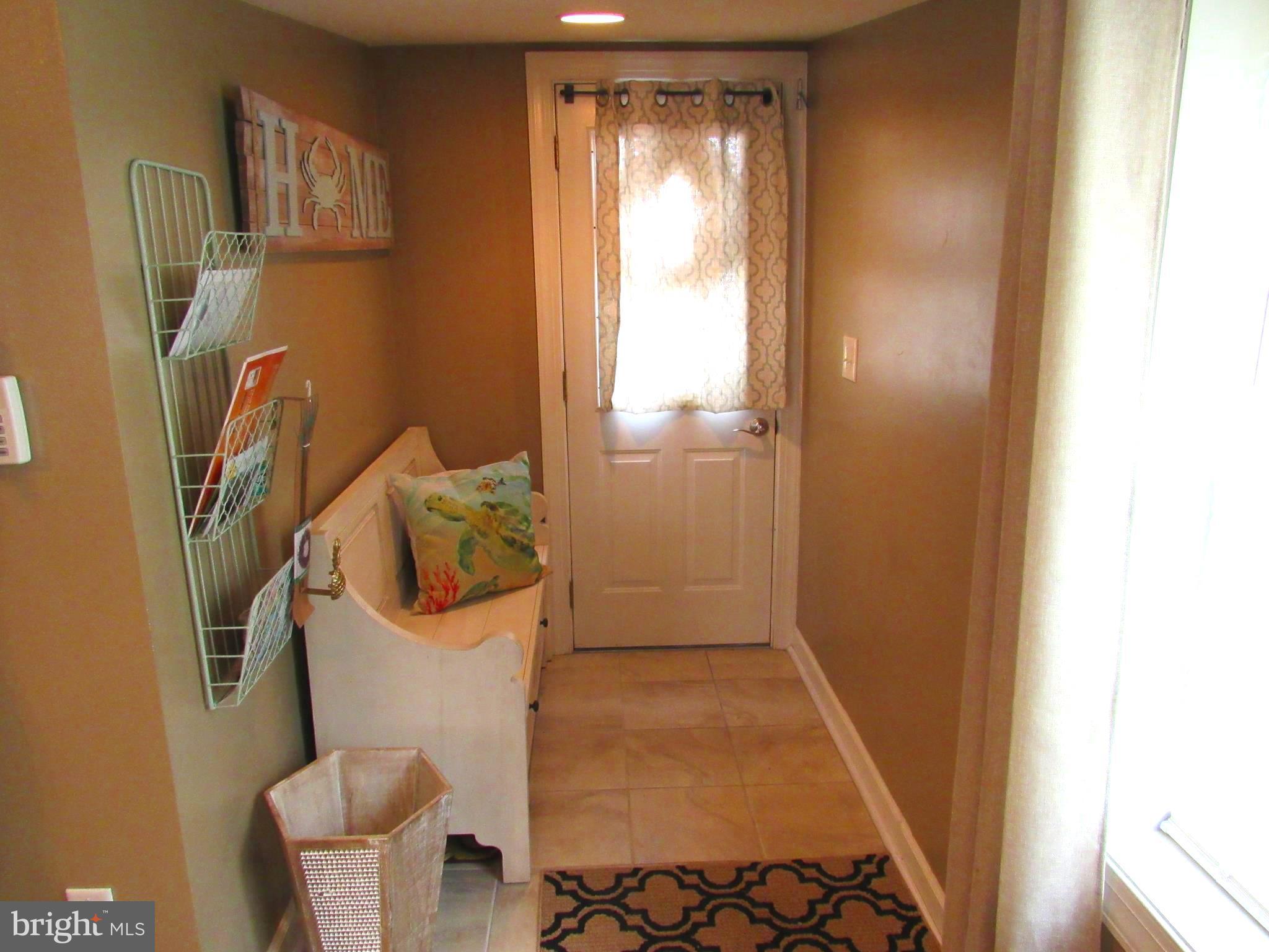 609 Cresswell Road Brooklyn, MD 21225 - Photo 22 of 25 Cozy entrance with room for a bench