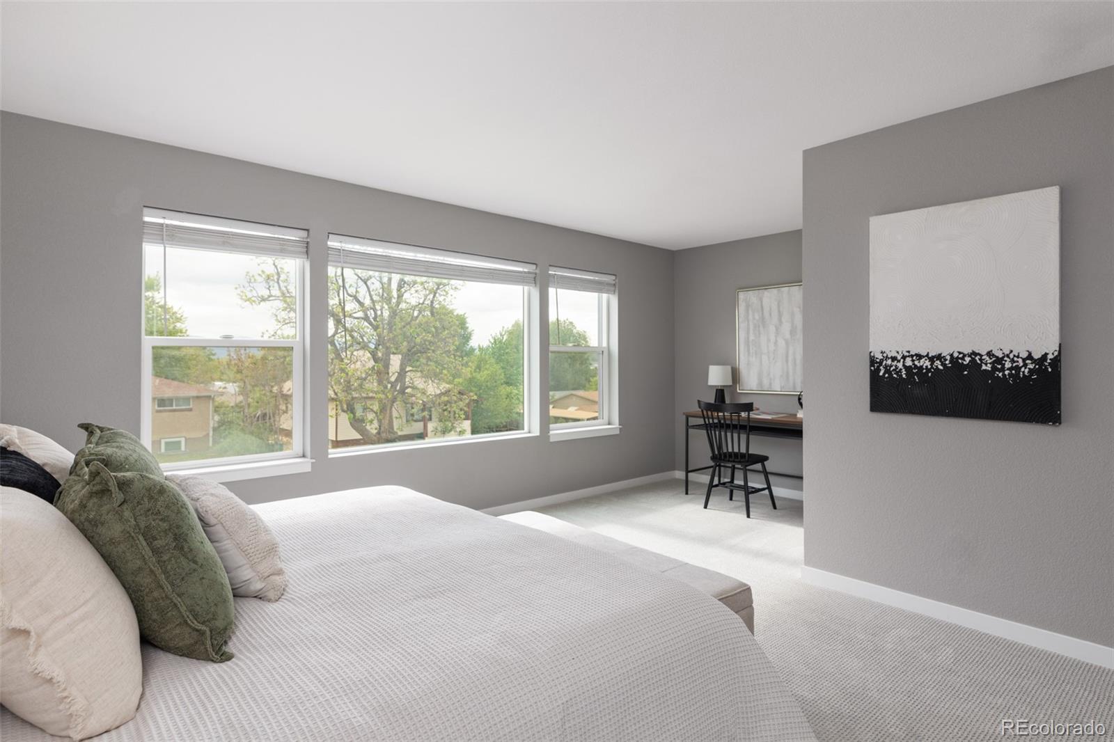 5230 Stuart Street Denver, CO 80212 - Photo 16 of 34 a bed sitting in a bedroom next to a window
