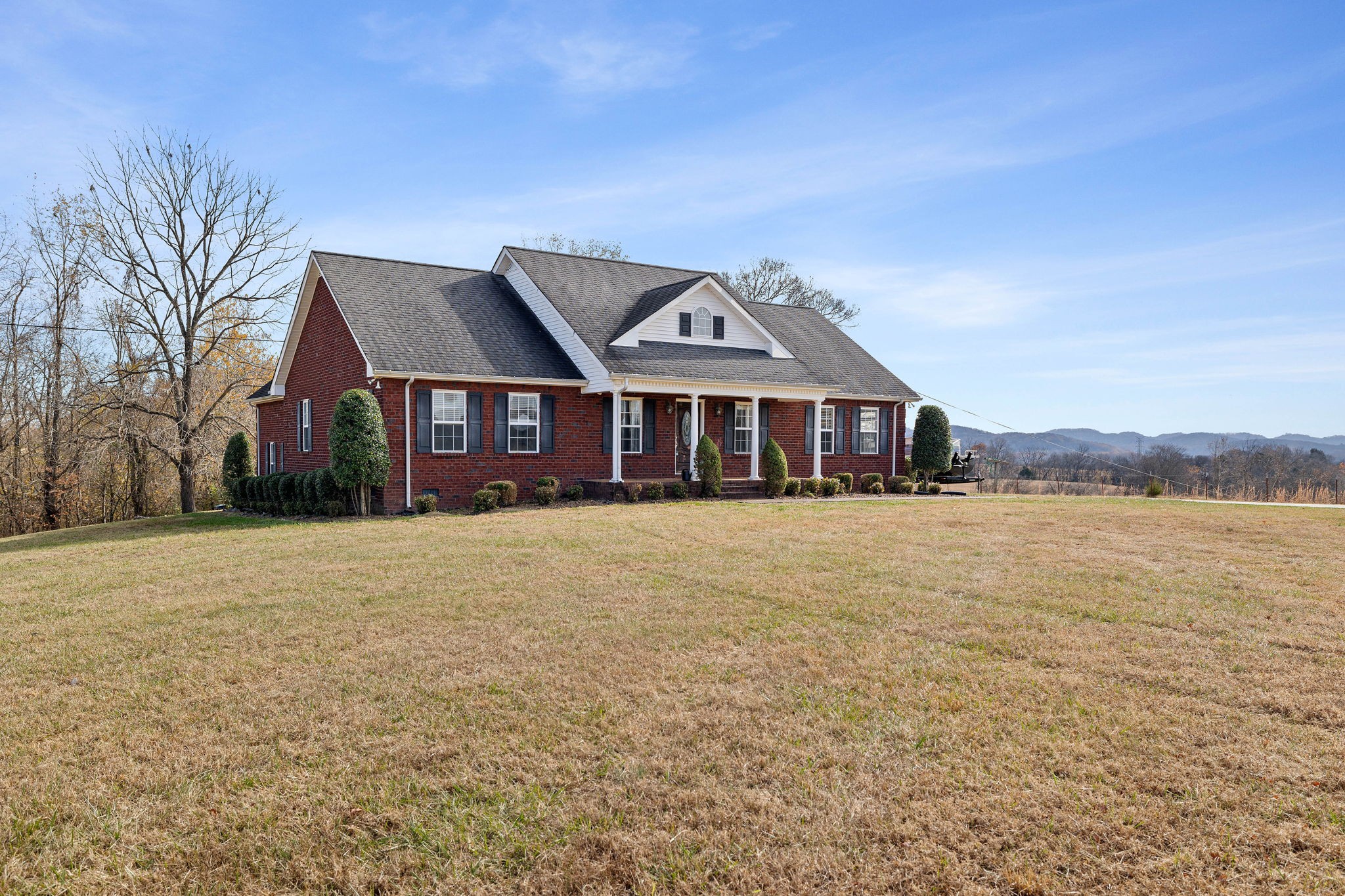 533 Rome Road Riddleton, TN 37151 - Photo 1 of 43 a front view of a house with a lake view