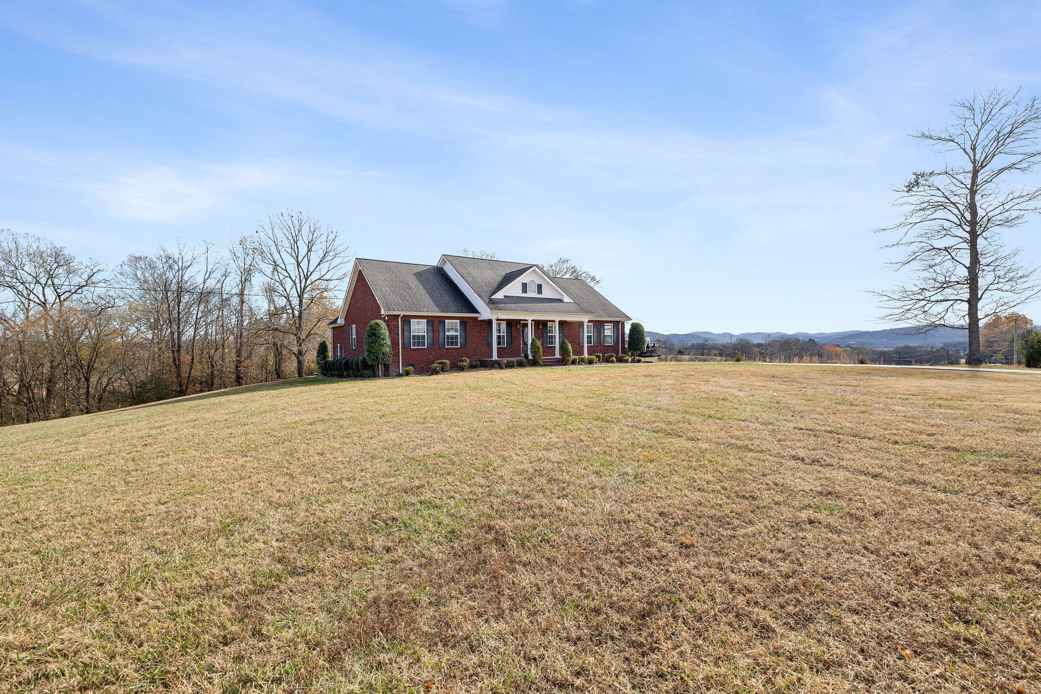 533 Rome Road Riddleton, TN 37151 - Photo 3 of 43 a front view of a house with a yard
