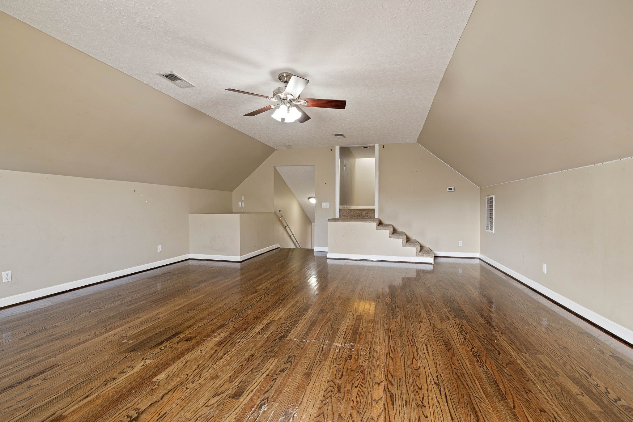 533 Rome Road Riddleton, TN 37151 - Photo 33 of 43 wooden floor in an empty room with a window