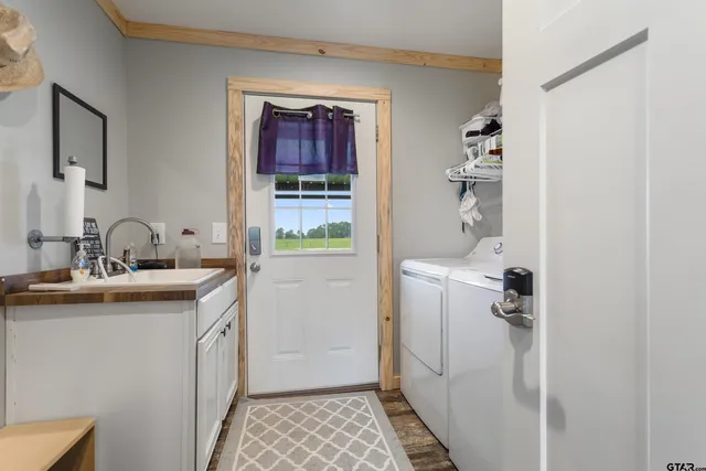 a bathroom with a sink and mirror with toilet