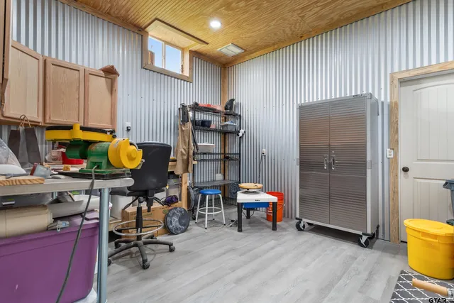 a view of a house with backyard and porch