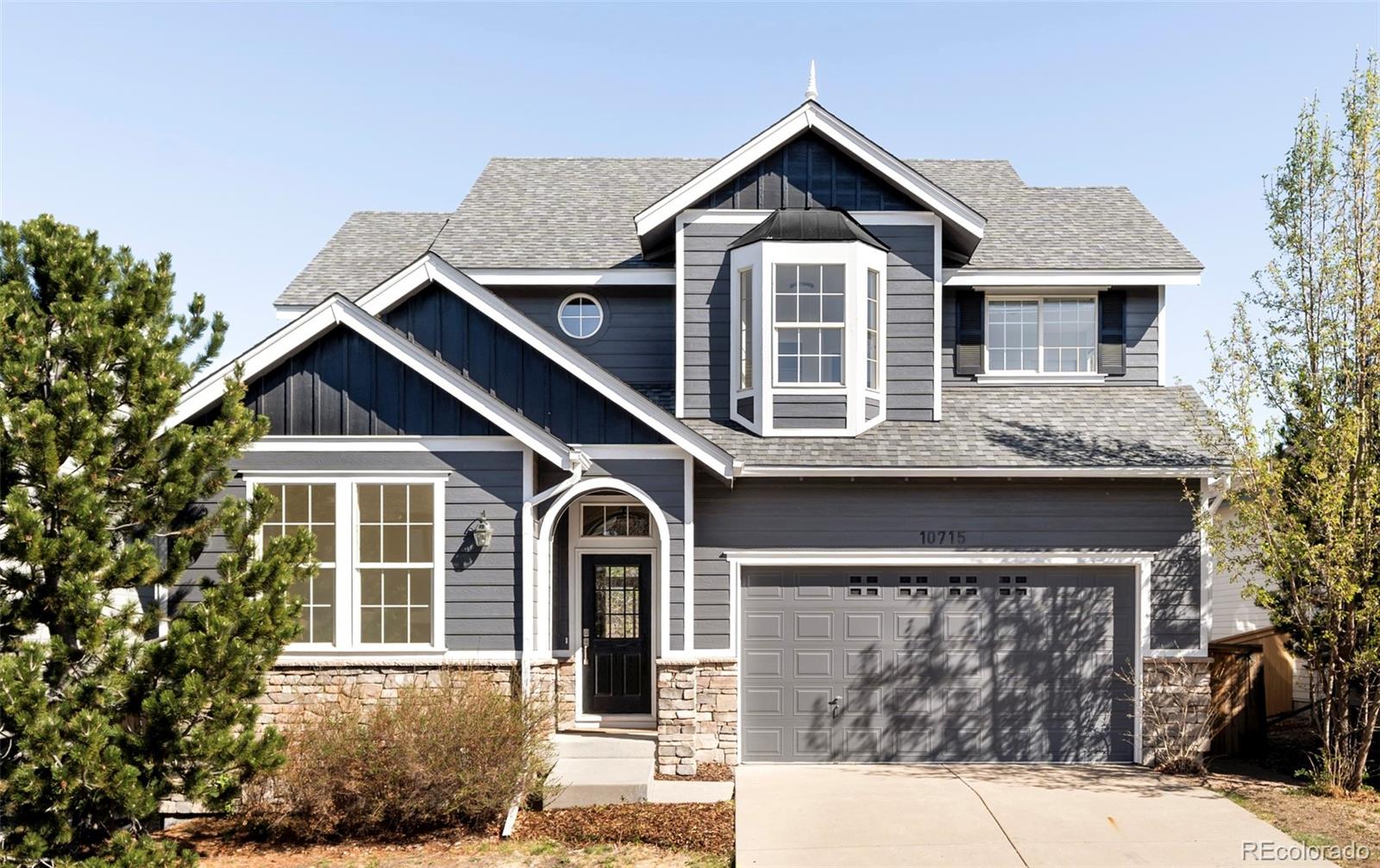 a front view of a house with yard