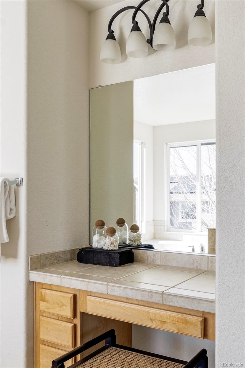 10715 Riverbrook Circle Highlands Ranch, CO 80126 - Photo 14 of 30 a bathroom with a sink and a mirror