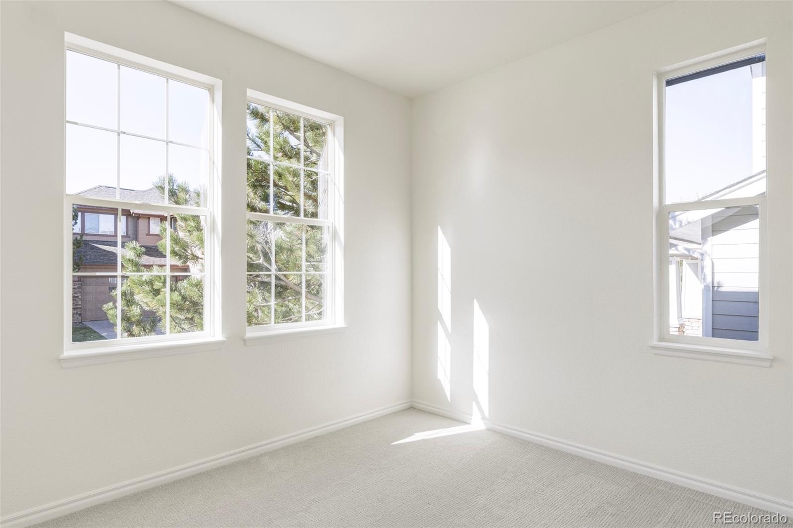10715 Riverbrook Circle Highlands Ranch, CO 80126 - Photo 16 of 30 an empty room with a window