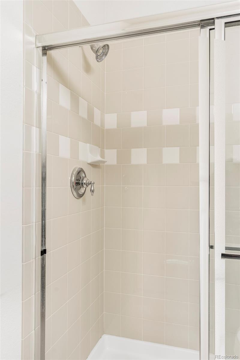 10715 Riverbrook Circle Highlands Ranch, CO 80126 - Photo 18 of 30 a bathroom with a shower and a shower