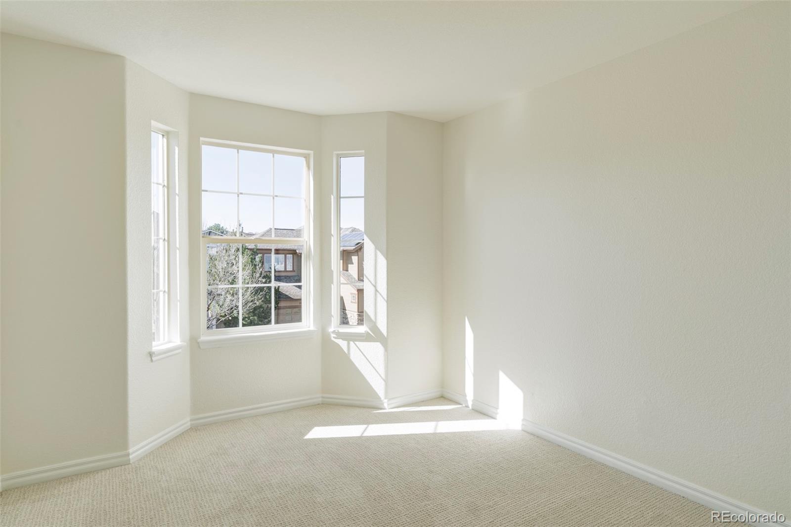 10715 Riverbrook Circle Highlands Ranch, CO 80126 - Photo 19 of 30 a view of an empty room with a window