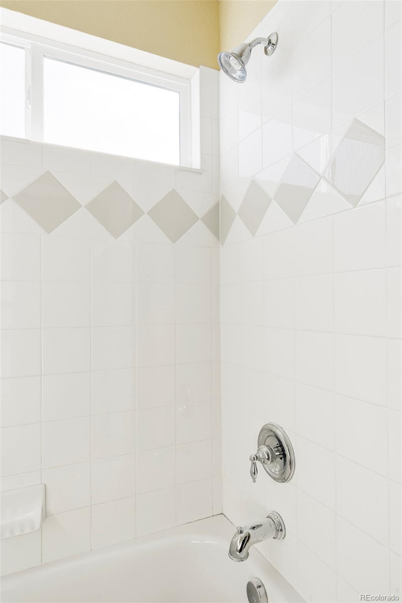10715 Riverbrook Circle Highlands Ranch, CO 80126 - Photo 21 of 30 a bathroom with a shower