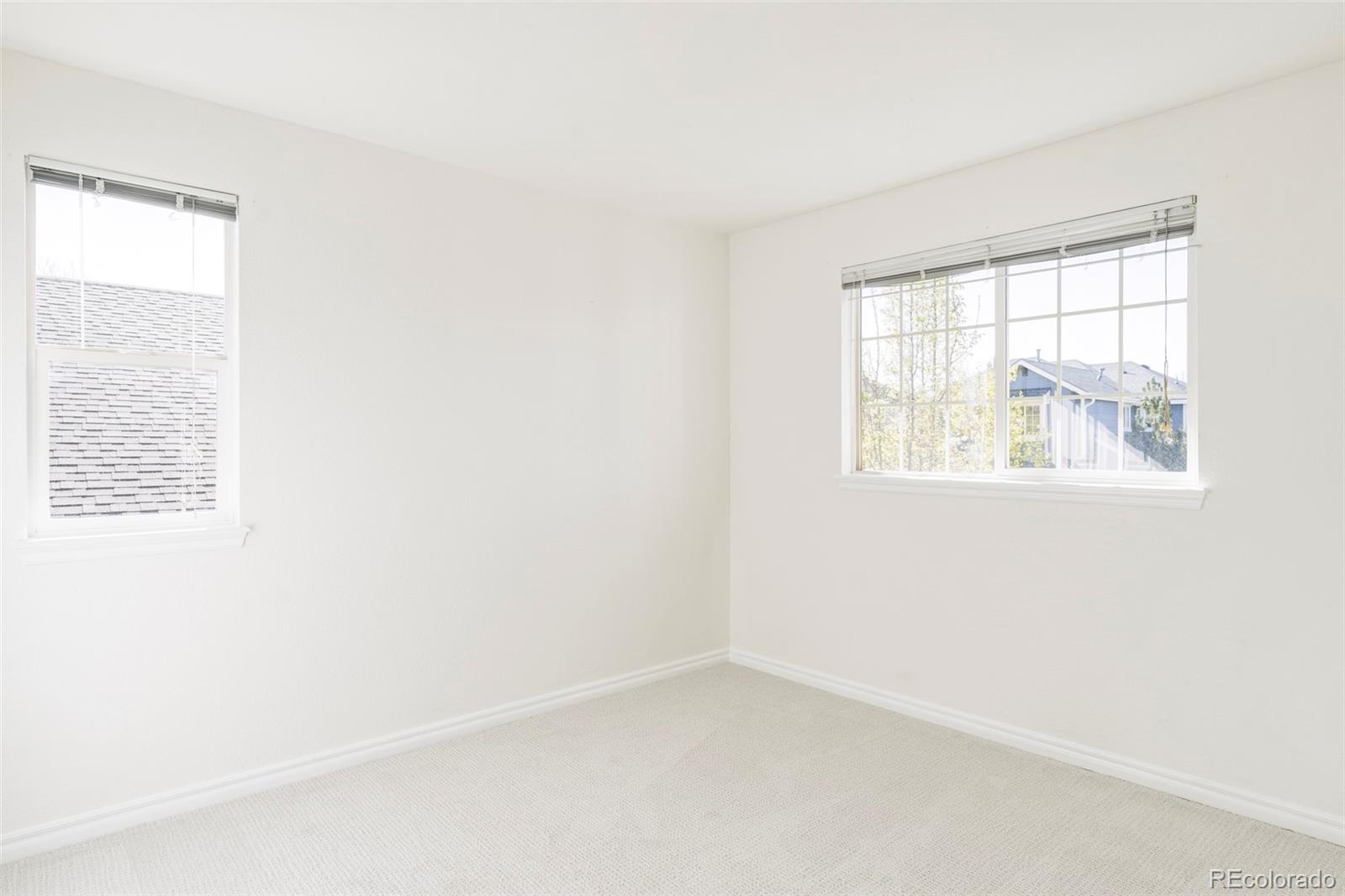10715 Riverbrook Circle Highlands Ranch, CO 80126 - Photo 22 of 30 an empty room with a window