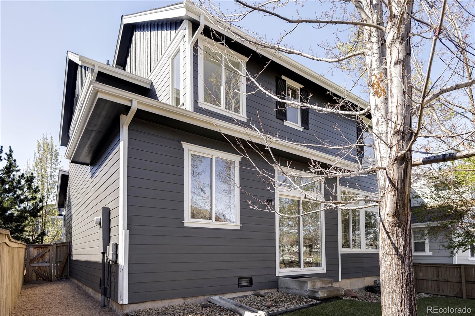 10715 Riverbrook Circle Highlands Ranch, CO 80126 - Photo 25 of 30 a front view of a building with a lot of windows