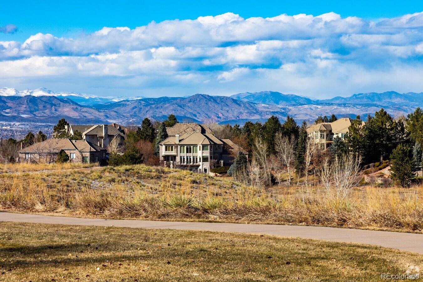 10715 Riverbrook Circle Highlands Ranch, CO 80126 - Photo 26 of 30 a view of houses with a yard