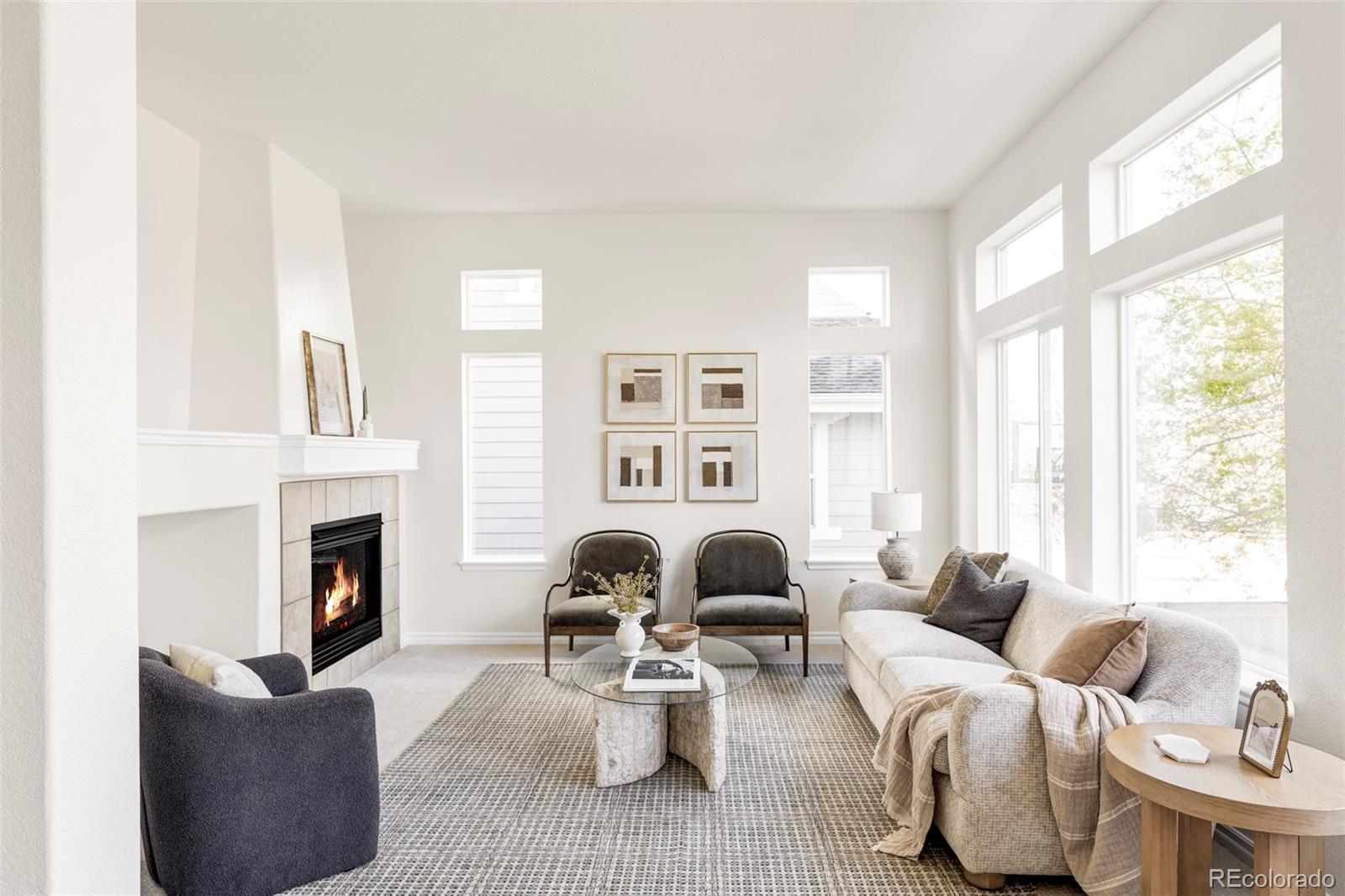 10715 Riverbrook Circle Highlands Ranch, CO 80126 - Photo 3 of 30 a living room with furniture fireplace and a large window