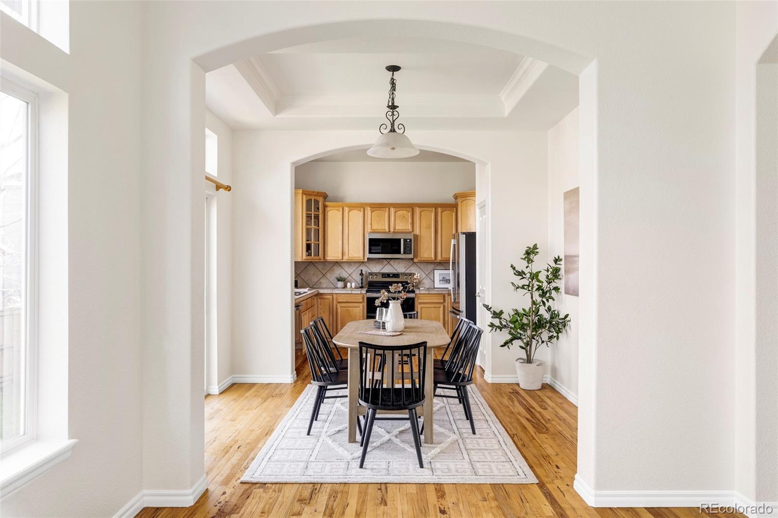 10715 Riverbrook Circle Highlands Ranch, CO 80126 - Photo 5 of 30 a view of a dining room with furniture and window