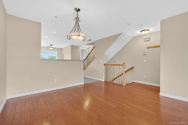 a view of a livingroom with wooden floor