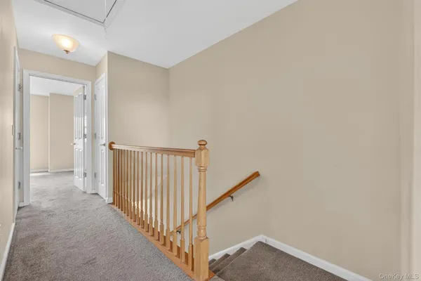 a view of staircase with rug