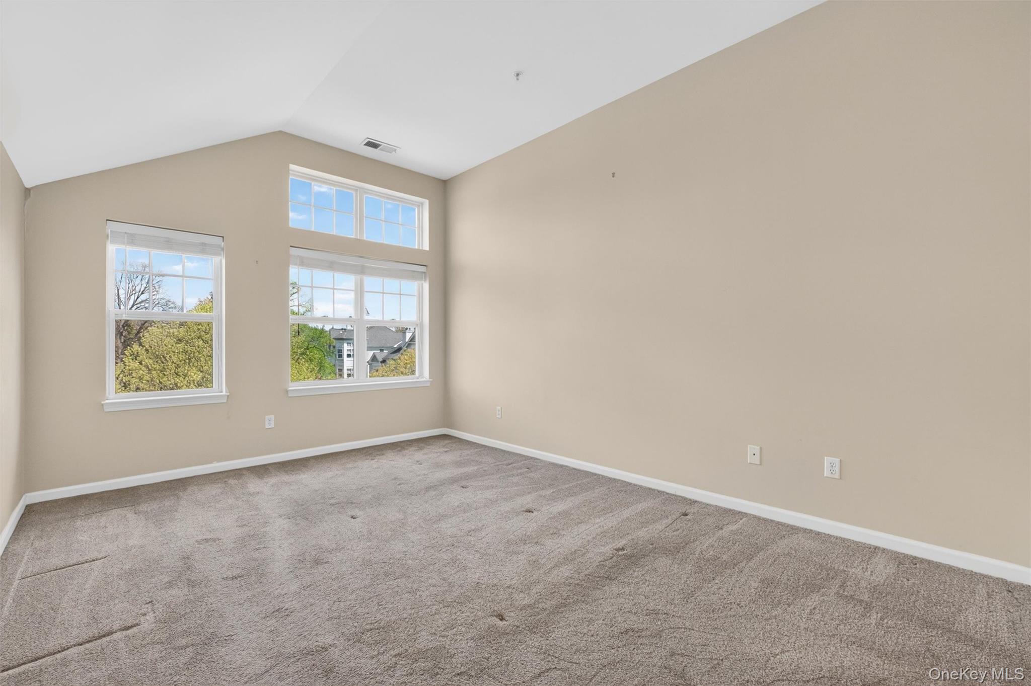 422 Highridge Court, Unit 422 Peekskill, NY 10566 - Photo 21 of 45 On the upper level, retreat to the spacious primary suite, complete with a walk-in closet and a luxurious en suite bathroom featuring double sinks, an expansive vanity, whirlpool tub, and separate shower.