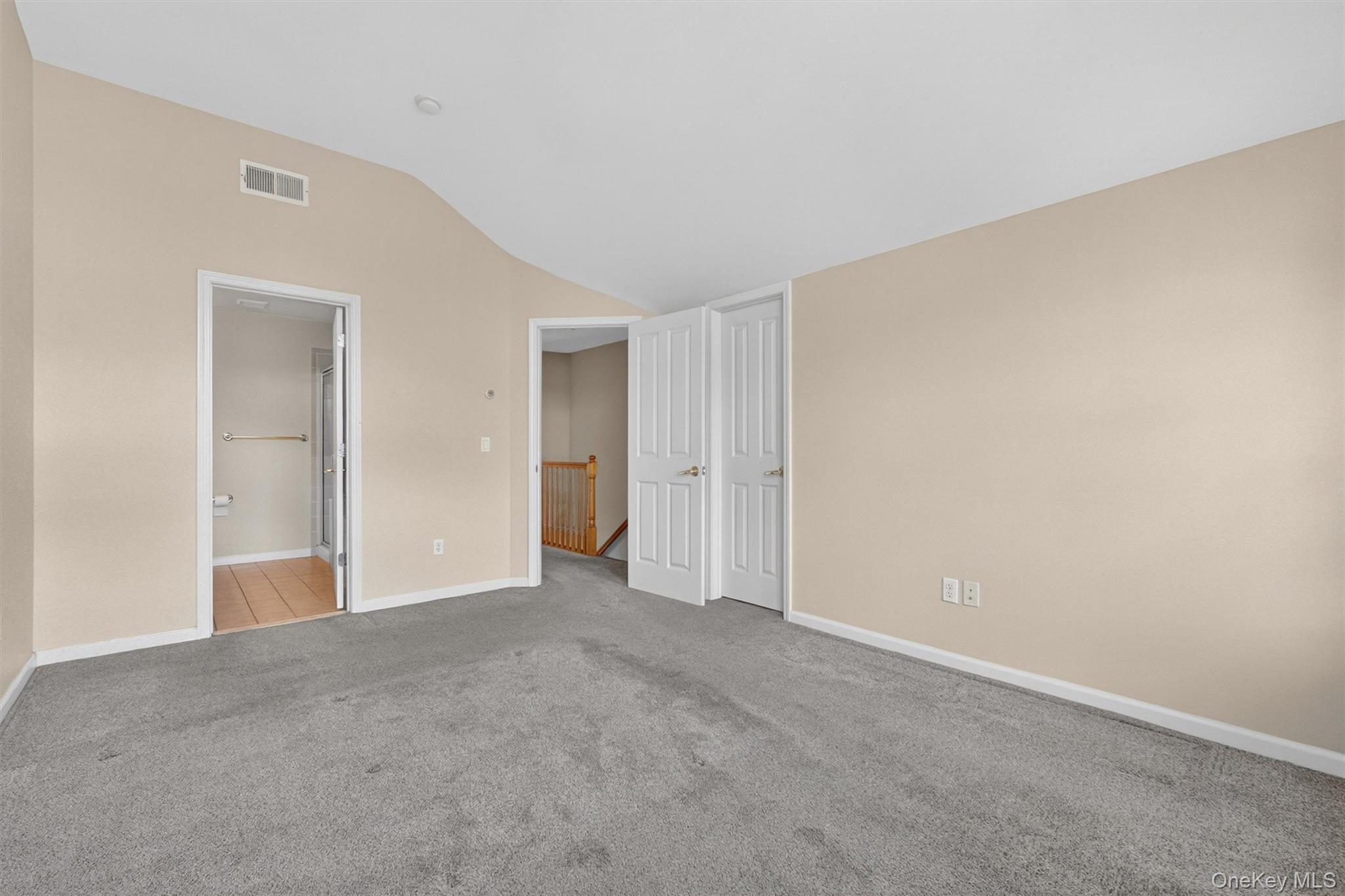 422 Highridge Court, Unit 422 Peekskill, NY 10566 - Photo 22 of 45 The spacious primary suite offers a true private retreat, featuring abundant natural light, a generous walk-in closet, and a serene, well-proportioned layout designed for comfort.