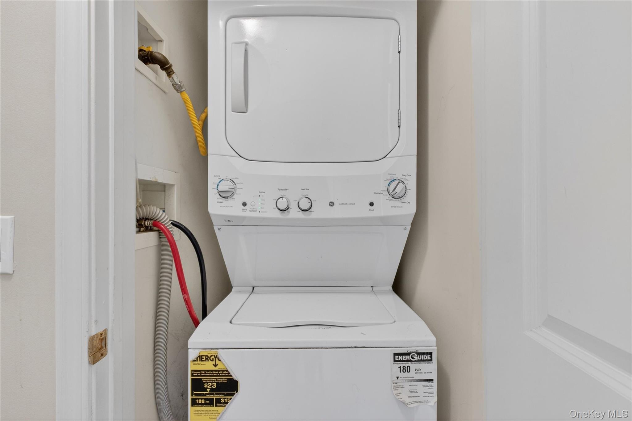422 Highridge Court, Unit 422 Peekskill, NY 10566 - Photo 27 of 45 An in-unit stacked washer and dryer is conveniently located in the upstairs hallway between the two bedrooms, offering easy access exactly where it’s needed most. Thoughtfully placed for everyday efficiency, this dedicated laundry area allows for seamless household routines without the need to carry loads between levels—adding a layer of comfort, practicality, and modern convenience to daily living.