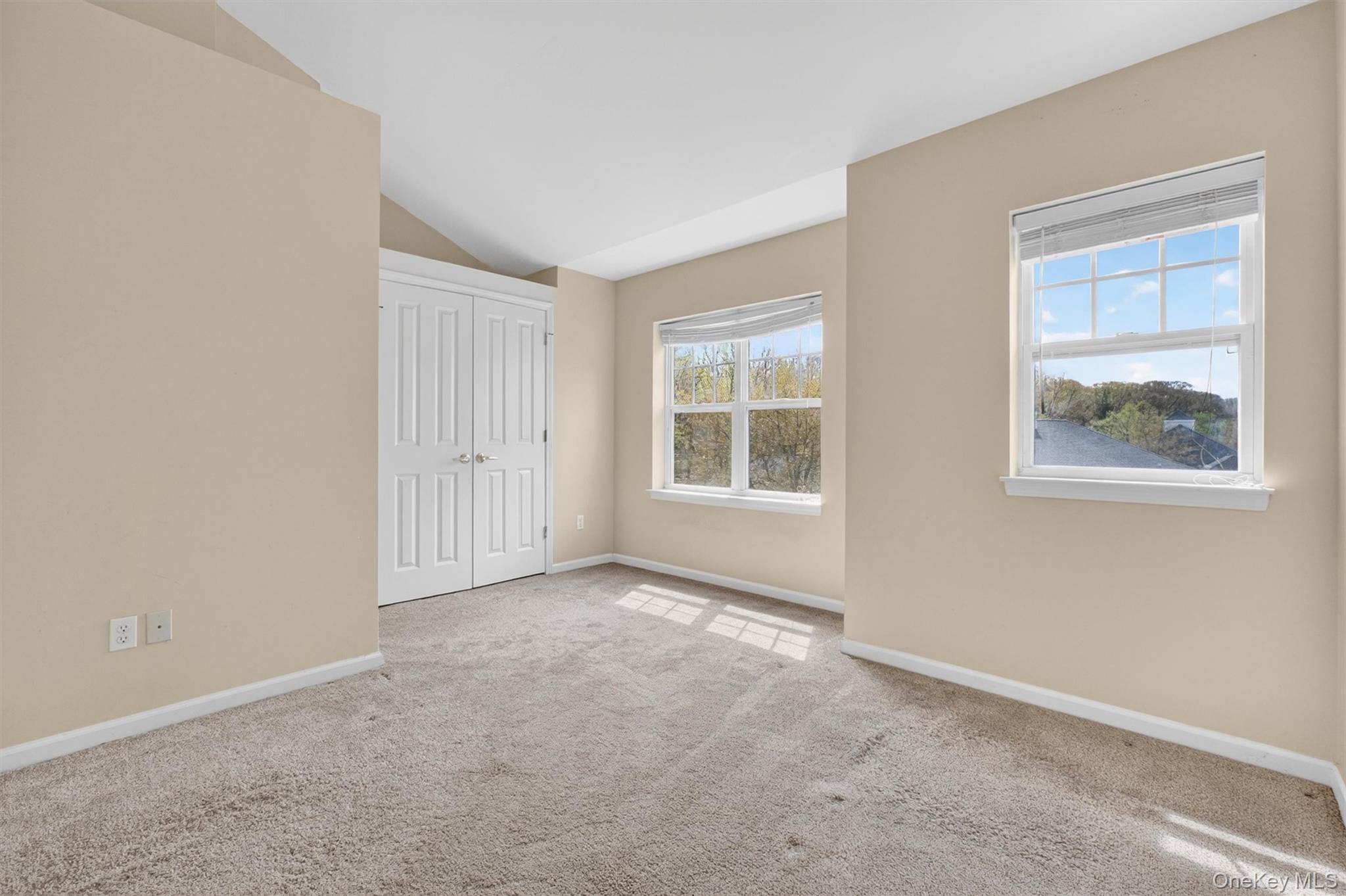 422 Highridge Court, Unit 422 Peekskill, NY 10566 - Photo 28 of 45 The second bedroom offers flexibility as a guest room or home office and provides a light and bright easterly exposure. The second fully tiled bathroom en suite