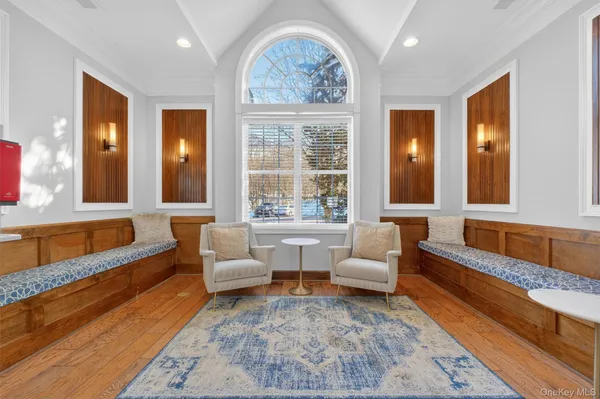 a dining room with furniture and a book shelf