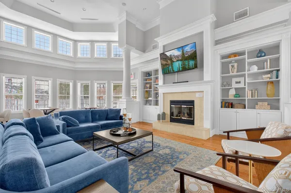 a living room with furniture fireplace and a fireplace