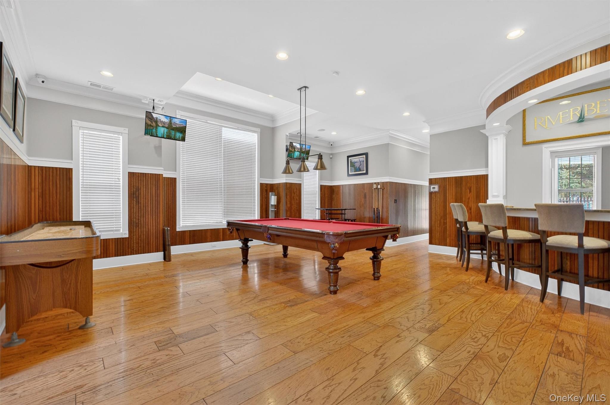 422 Highridge Court, Unit 422 Peekskill, NY 10566 - Photo 38 of 45 The clubhouse features a dedicated billiards area, offering a relaxed and inviting space to unwind and connect with neighbors. Perfect for friendly games or casual gatherings, this thoughtfully designed area adds a social element to the community, creating another opportunity to enjoy the lifestyle Riverbend has to offer.