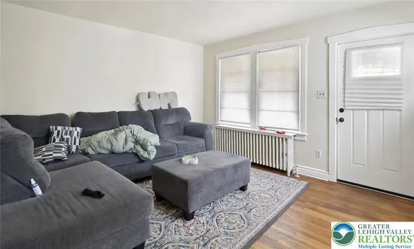 a living room with furniture and a window