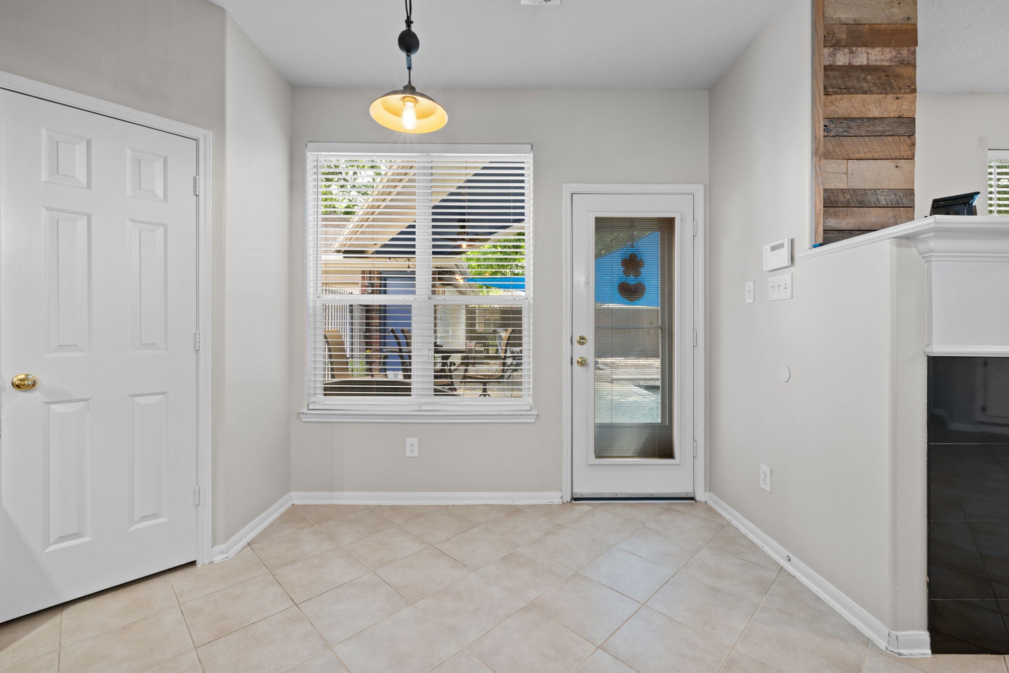 19114 Emory Trail Spring, TX 77388 - Photo 18 of 44 an empty room with a window and chandelier