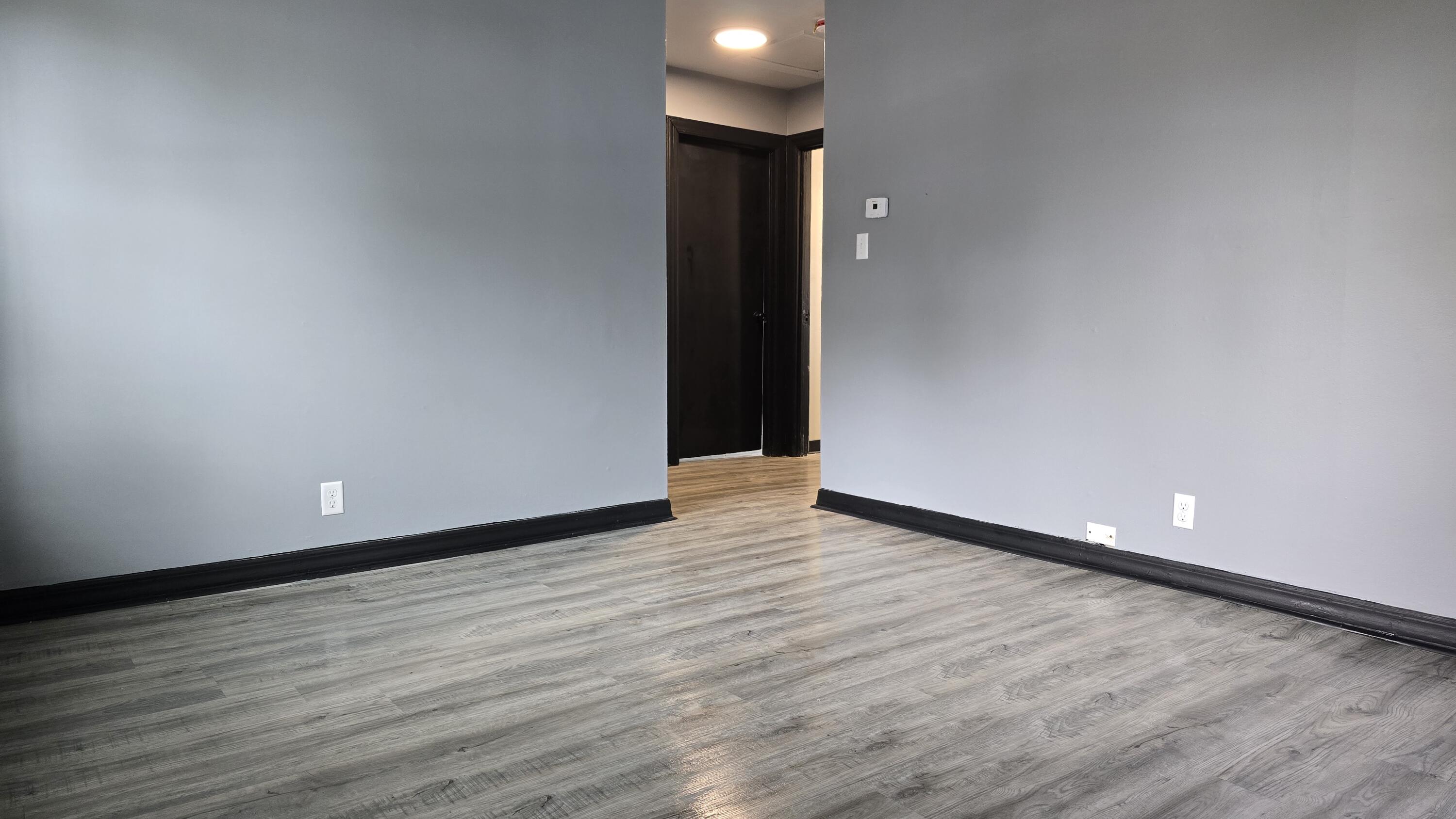 2854 Hancock Street Gary, IN 46405 - Photo 4 of 13 a view of an empty room with wooden floor