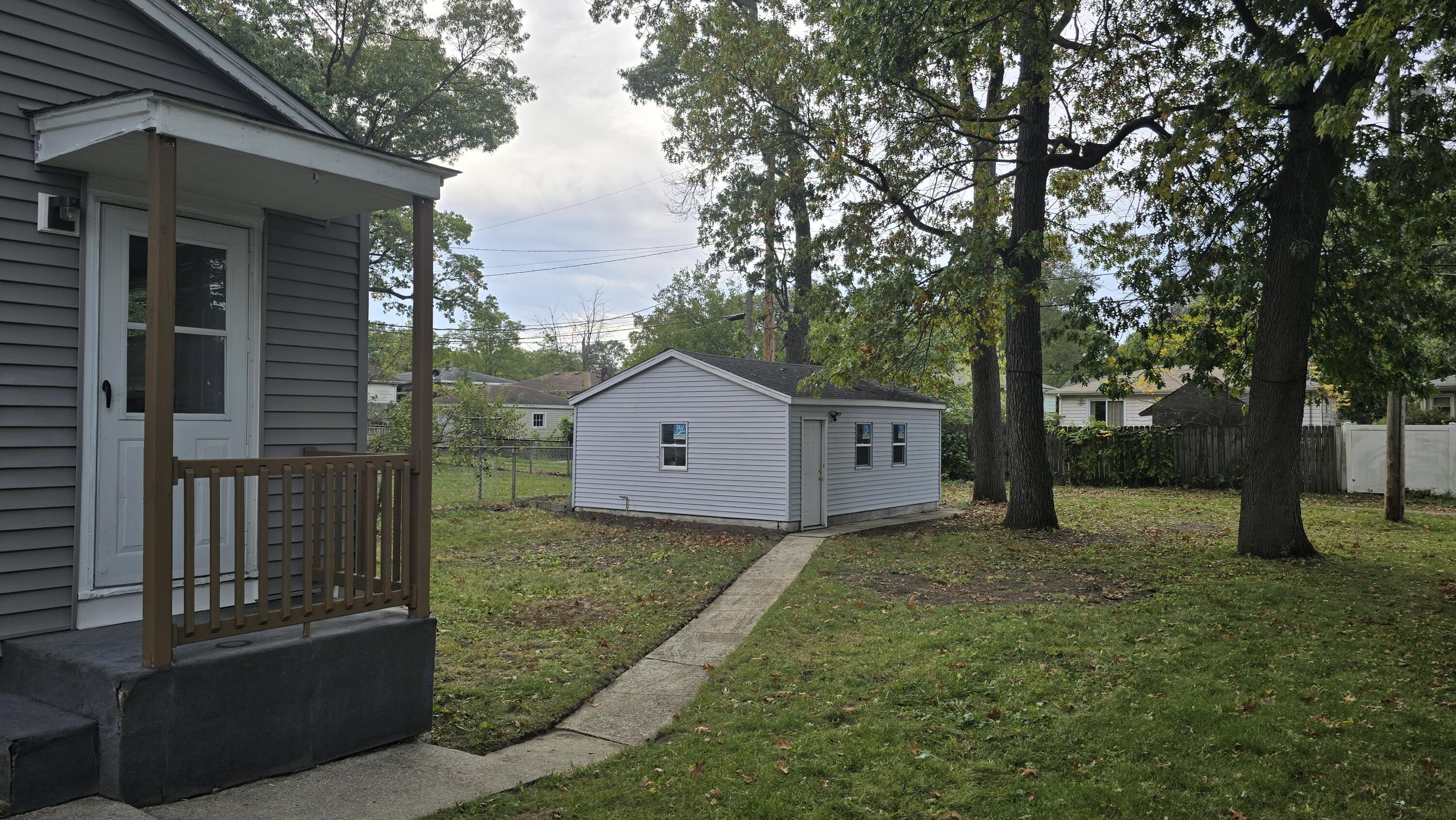 2854 Hancock Street Gary, IN 46405 - Photo 5 of 13 front view of a house with a yard