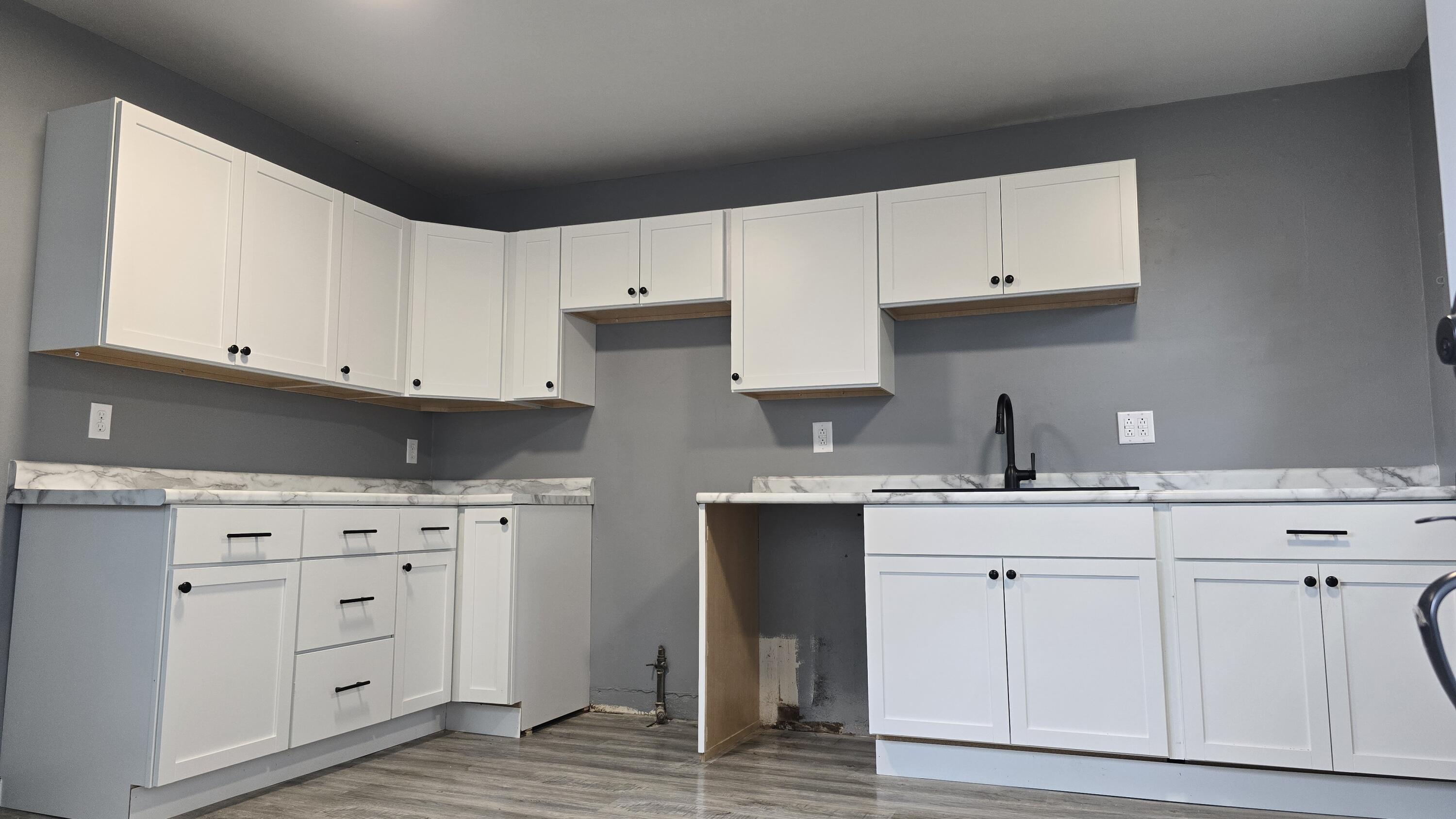 2854 Hancock Street Gary, IN 46405 - Photo 7 of 13 a kitchen with white cabinets and sink