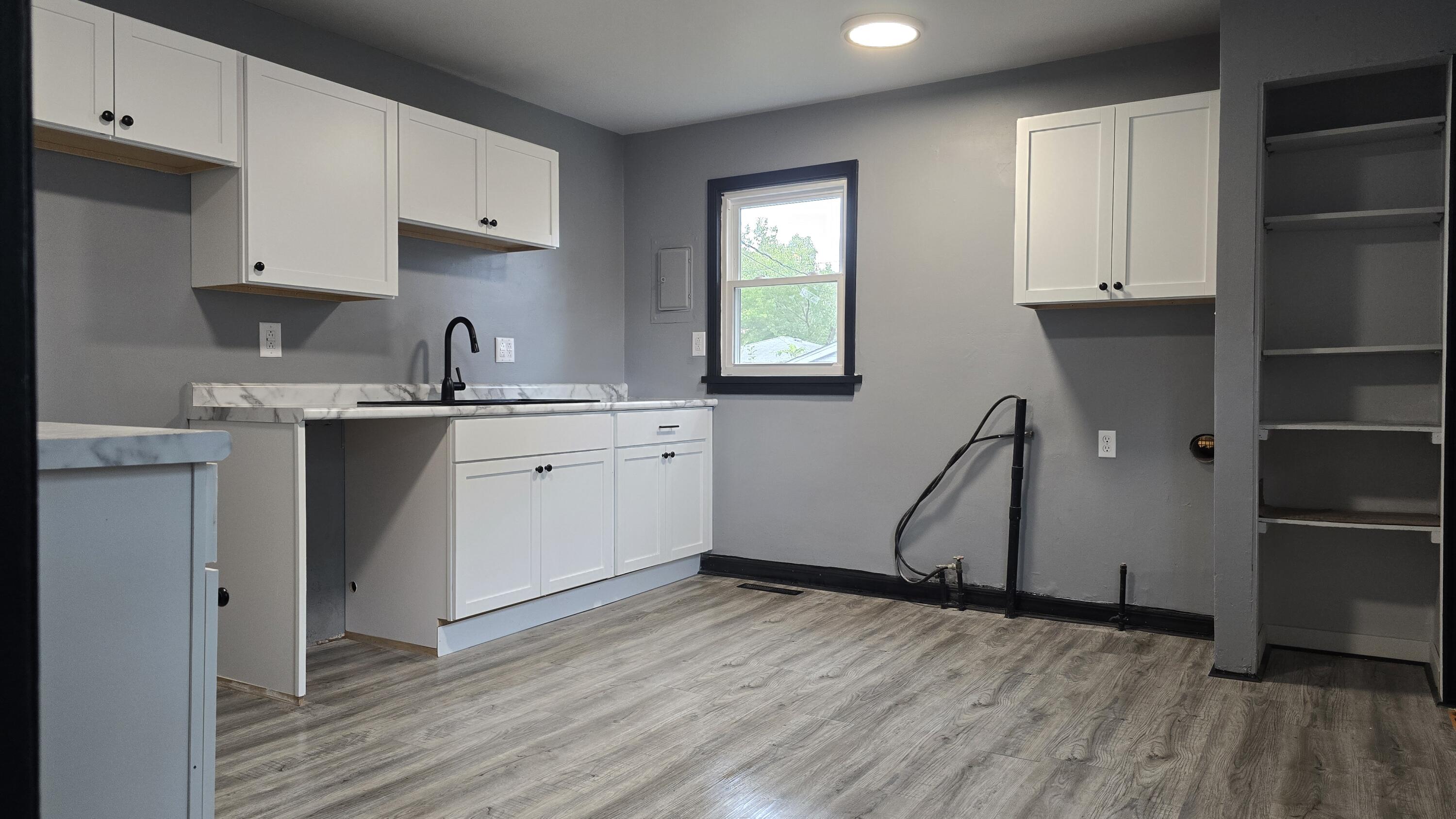 2854 Hancock Street Gary, IN 46405 - Photo 8 of 13 a kitchen with a sink appliances and cabinets