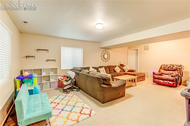 7403 Farmcrest Road Colorado Springs, CO 80925 - Photo 12 of 17 Family Room.... Great for entertaining!