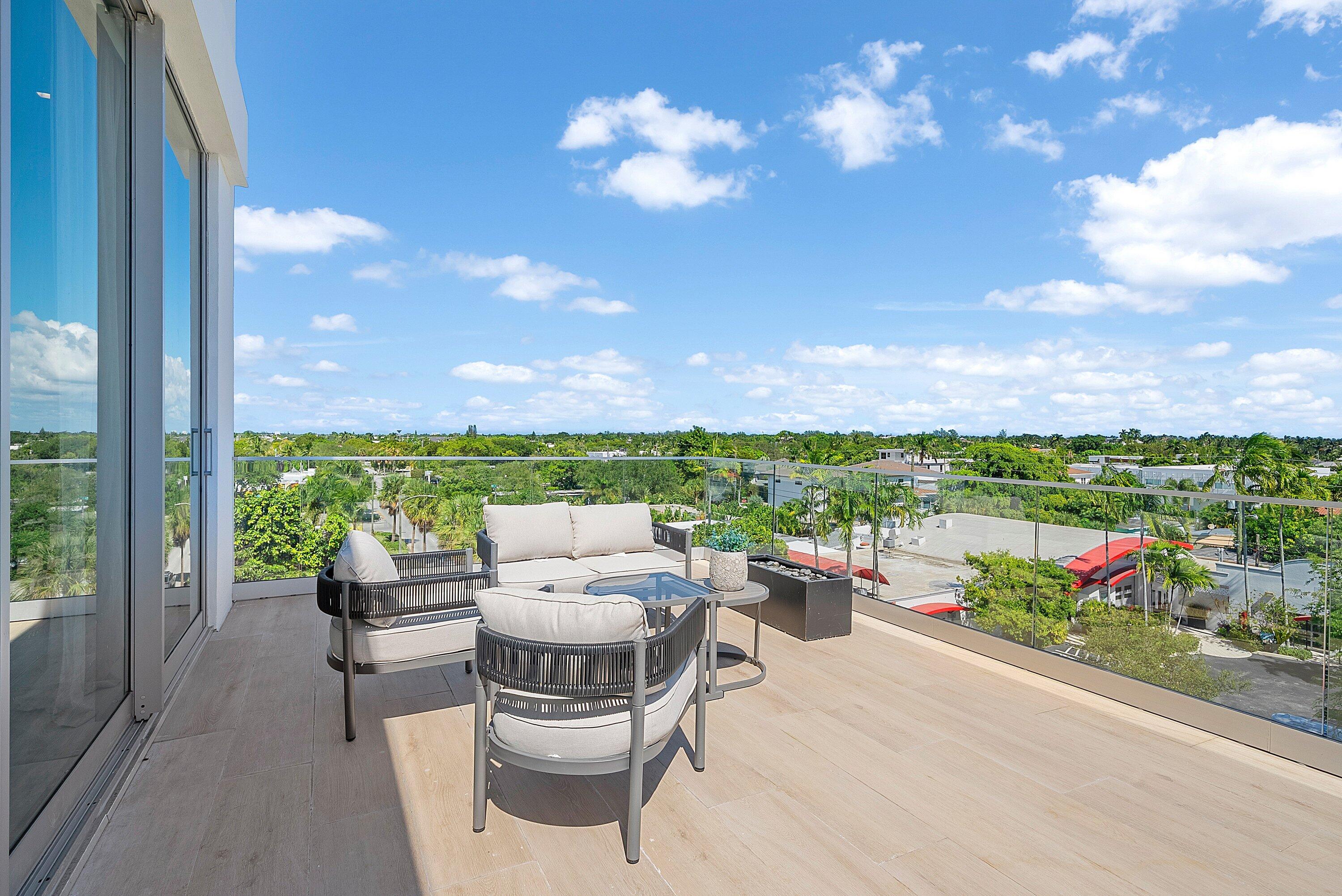 246 Northeast 6th Avenue, Unit PH Delray Beach, FL 33483 - Photo 15 of 36 a outdoor living space with furniture and garden view