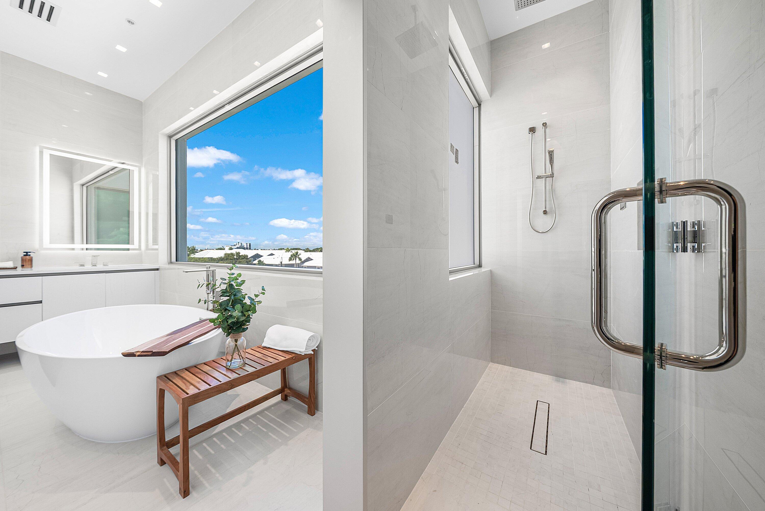 246 Northeast 6th Avenue, Unit PH Delray Beach, FL 33483 - Photo 23 of 36 a bathroom with a sink toilet and shower