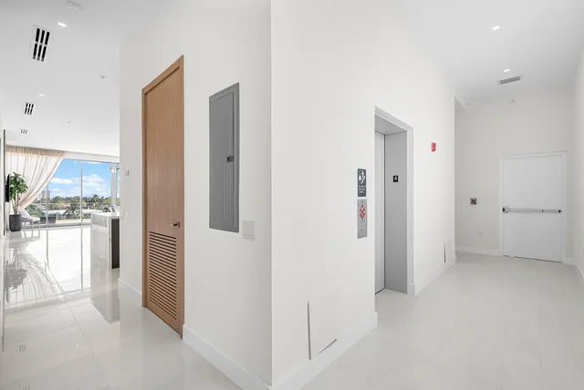 a view of a kitchen with a refrigerator and a stove